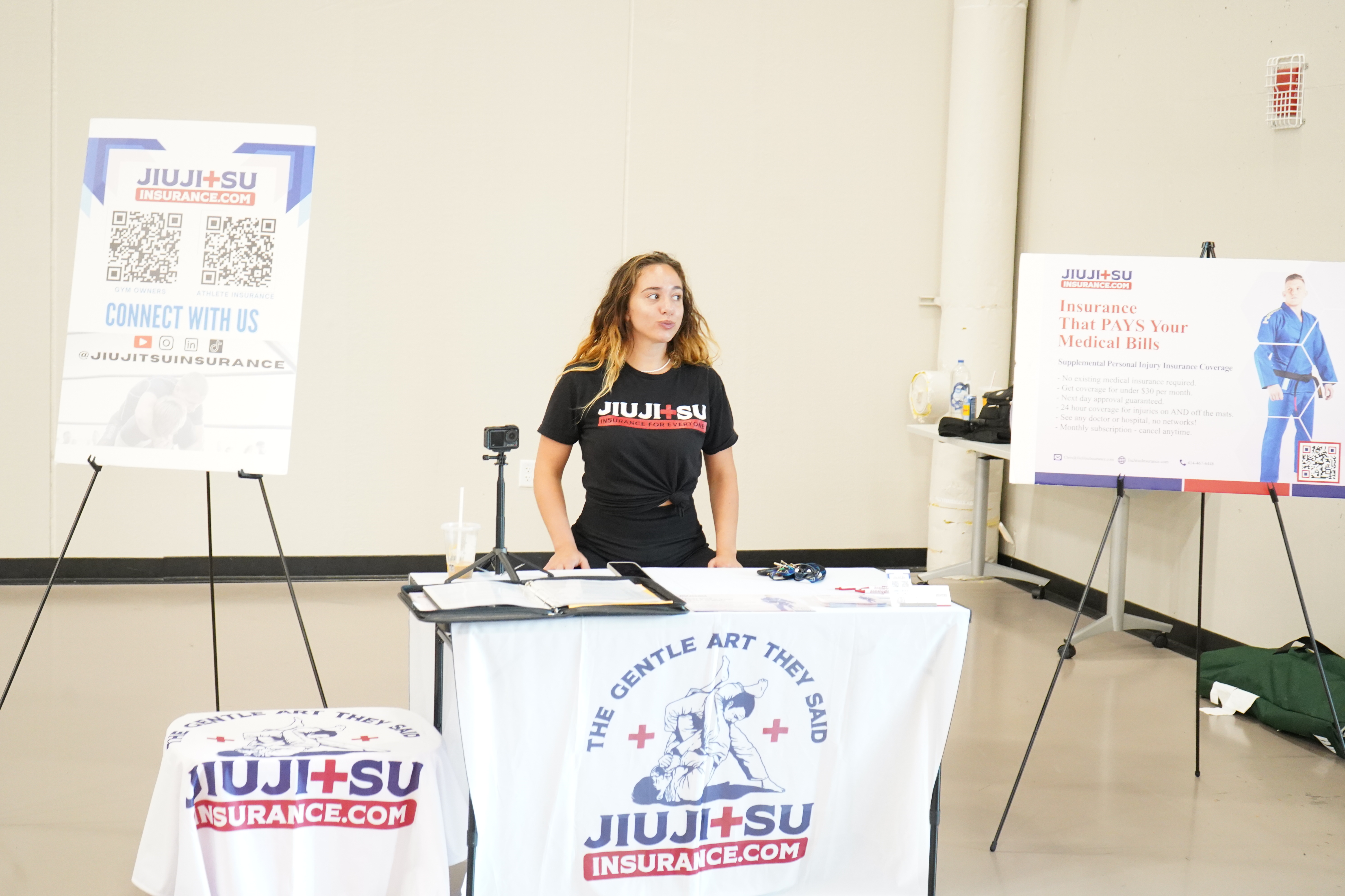 Alexandra King manning the Jiu Jitsu Insurance event booth — Event & Brand Promotion in action